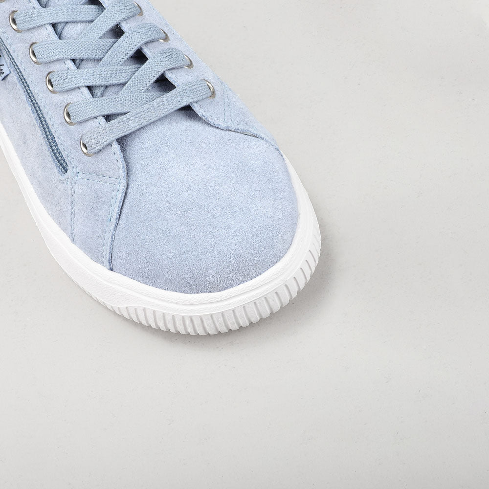 Close-up of Naked Arches Nelly Denim sneakers showing denim fabric, stylish design, and brand logo on the side.