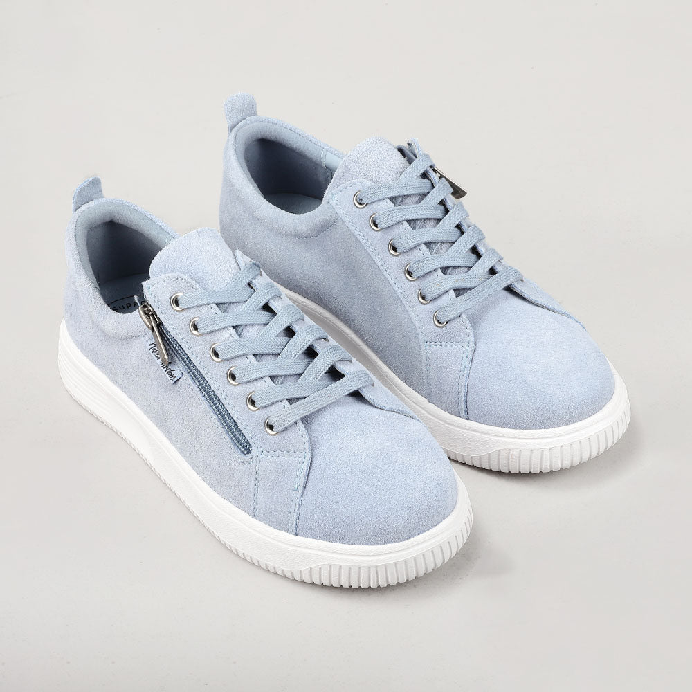 Naked Arches Nelly Denim sneakers with denim and suede upper, white rubber sole, and lace-up design.