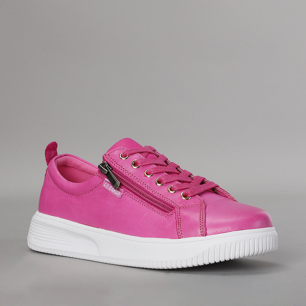 Naked Arches Nelly Hot Pink sneakers with vibrant fuchsia color and sleek design, shown from a side angle.