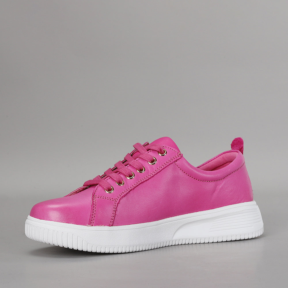 Naked Arches Nelly Hot Pink sneakers with vibrant fuchsia color and casual lace-up design on a white background.