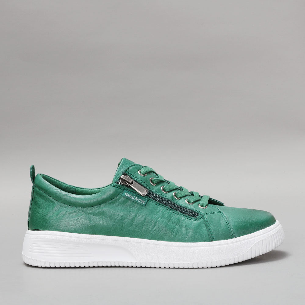 Naked Arches Nelly Jade sneakers showing side view with green and beige color accents and modern design.