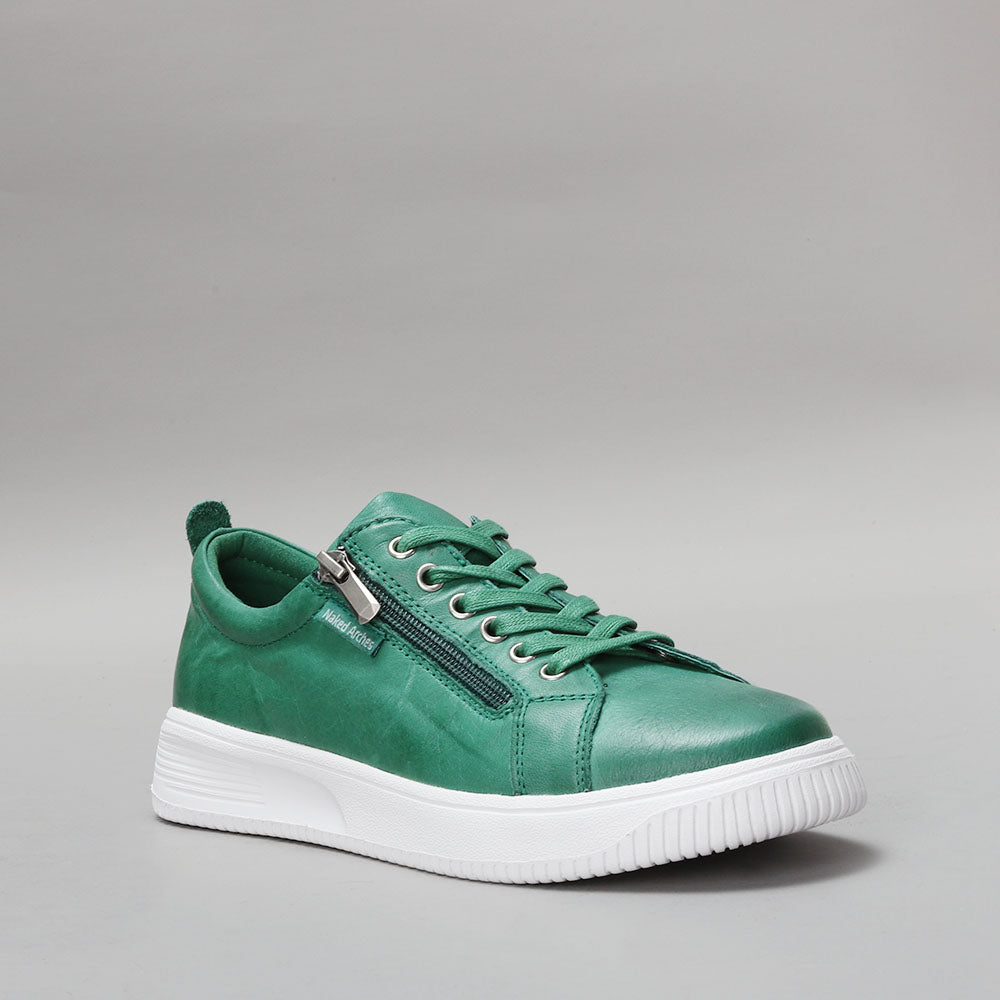 Naked Arches Nelly Jade sneakers with light green and beige design, featuring comfortable lace-up style and casual footwear look.