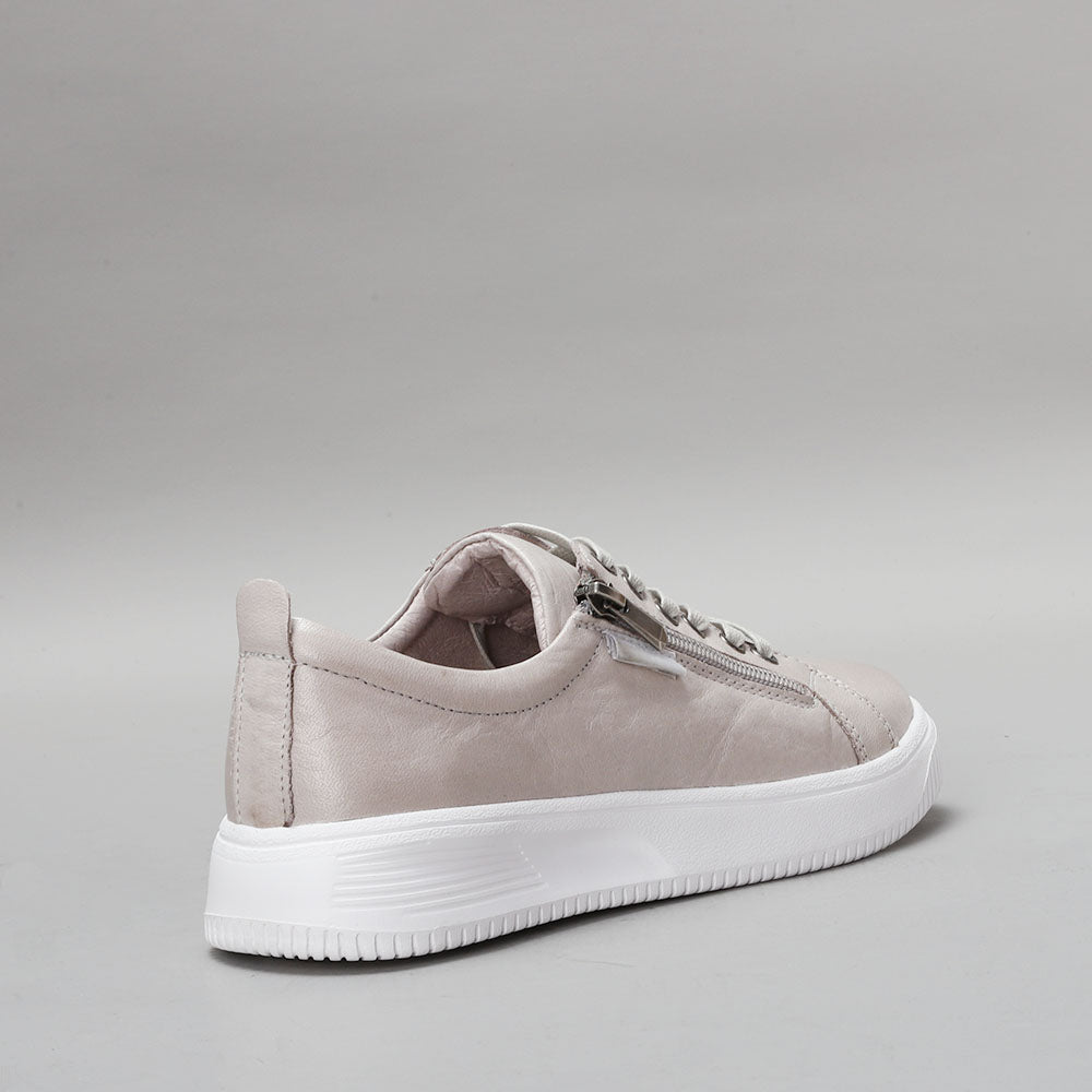 Naked Arches Nelly Silver Grey sneakers with sleek design and silver-grey color, featuring supportive arches and casual athletic style.