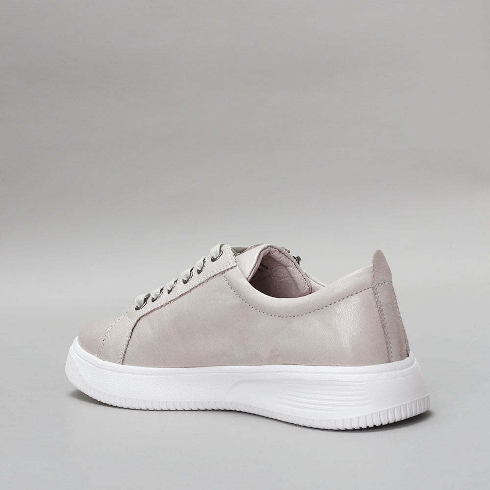 Naked Arches Nelly Silver Grey sneakers with sleek design and silver-grey color, showcased on a white background.