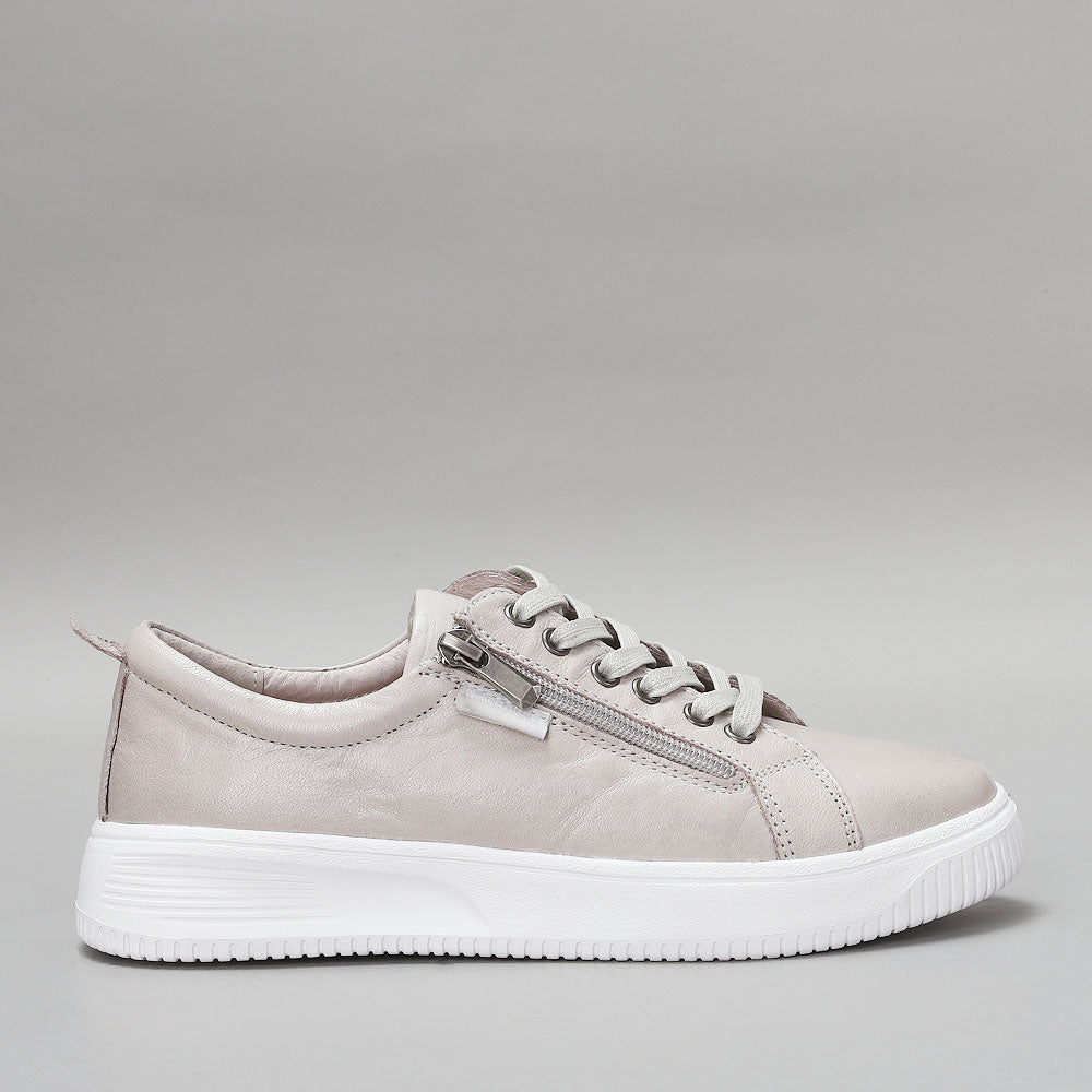 Naked Arches Nelly Silver Grey sneakers shown from the side, featuring sleek silver-grey design and comfortable casual footwear.