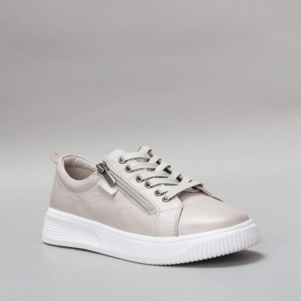 Naked Arches Nelly Silver Grey sneakers with sleek design and silver-grey color, displayed from a southeast angle.