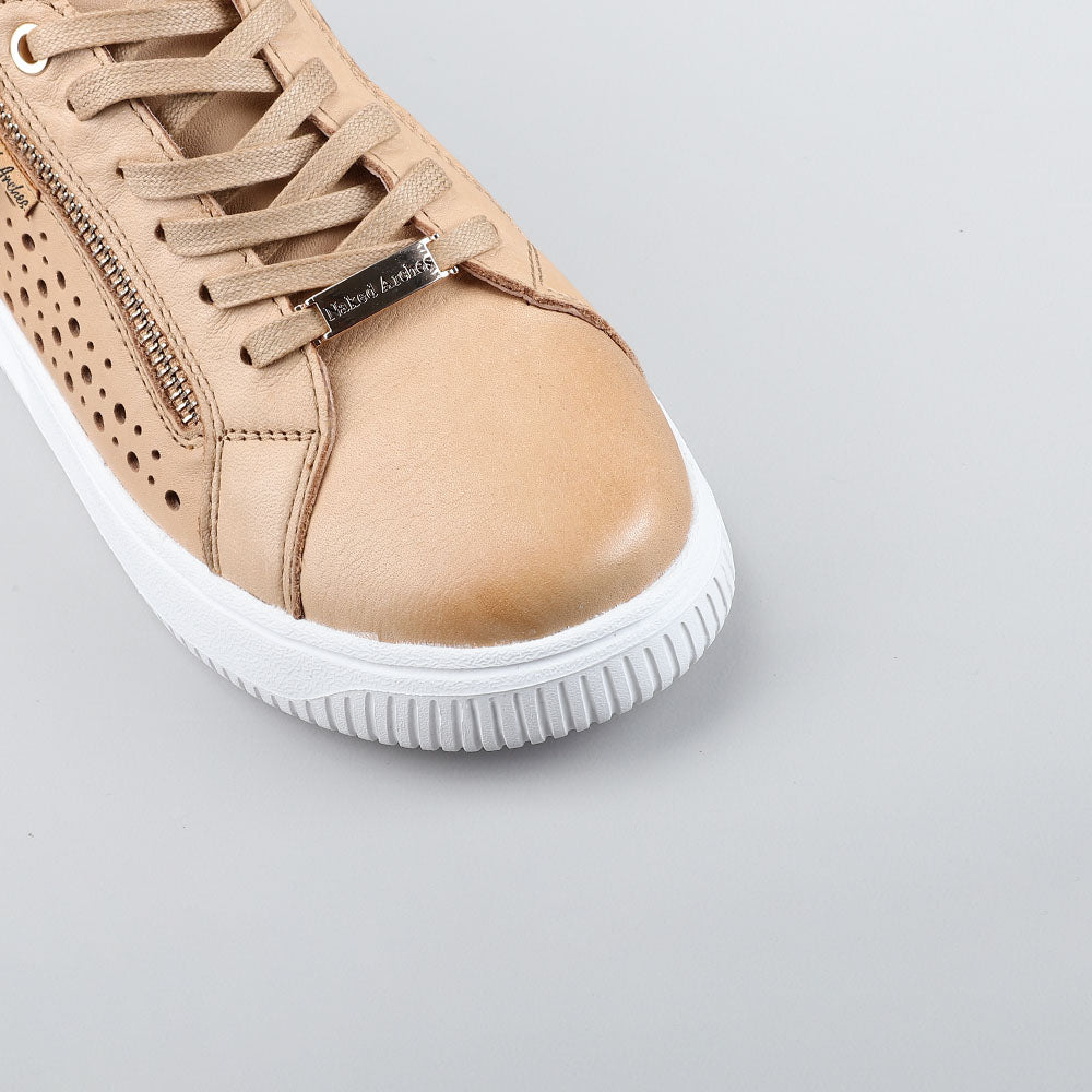 Close-up of Naked Arches Noble Scissors sneakers showing the sleek design and stylish black and white colorway.