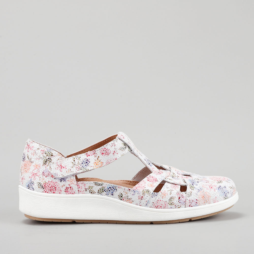 CC Resorts Nove White Floral casuals with white floral design, showcasing comfortable footwear style and intricate pattern details.