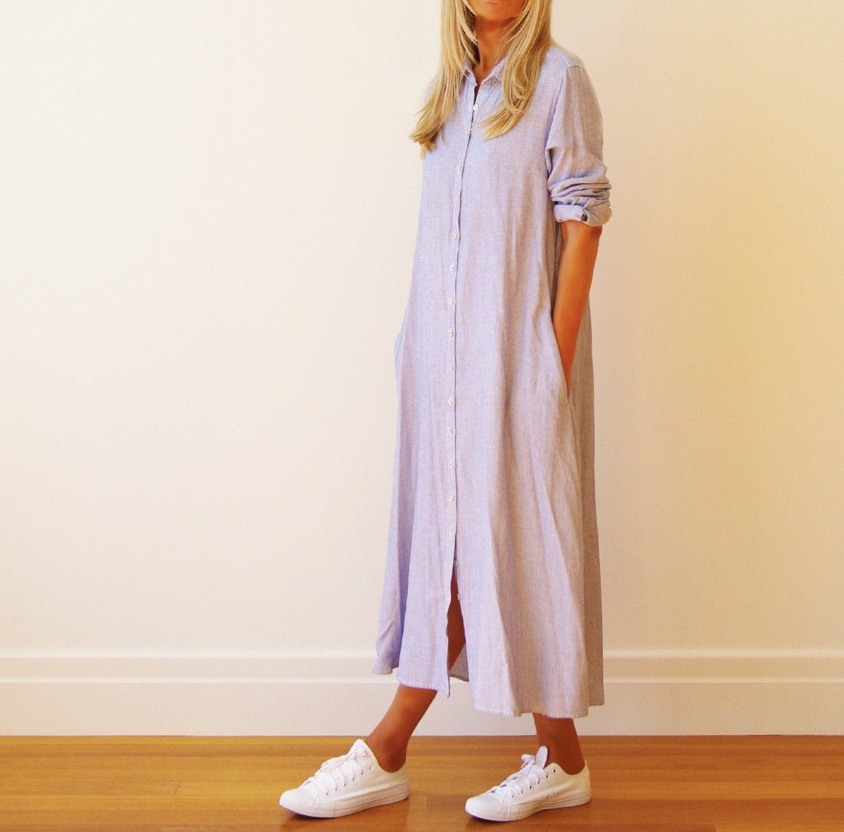 Blue and white striped dress by Who's Charlie with long yarn detail, perfect for stylish casual wear.