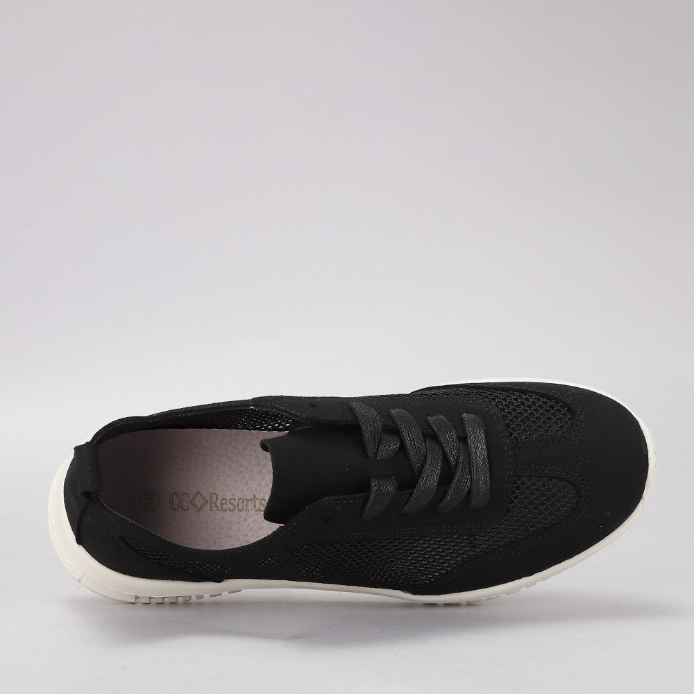 Black CC Resorts Oswald sneakers with a sleek design and comfortable fit, featuring stylish black uppers and casual sneaker style.