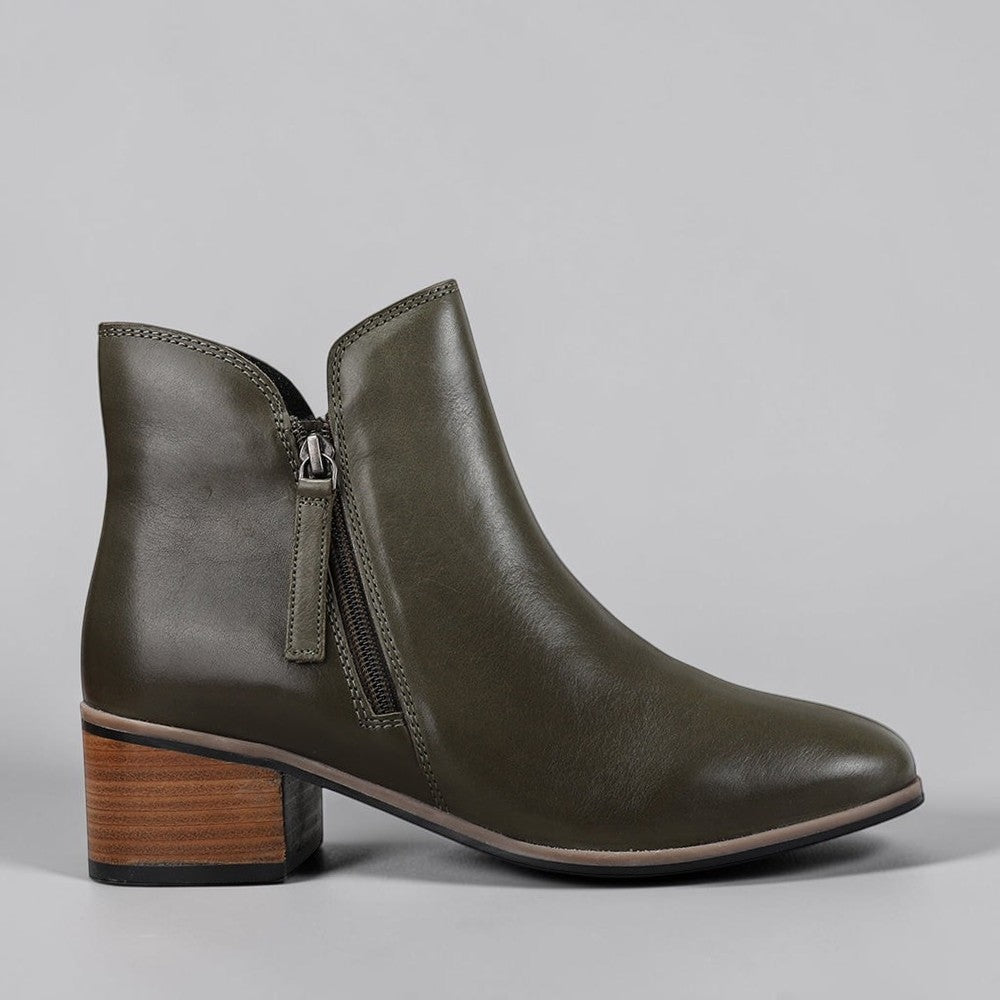 LE SANSA Oxley olive boots with ankle-height design, featuring a sleek silhouette and subtle stitching details.