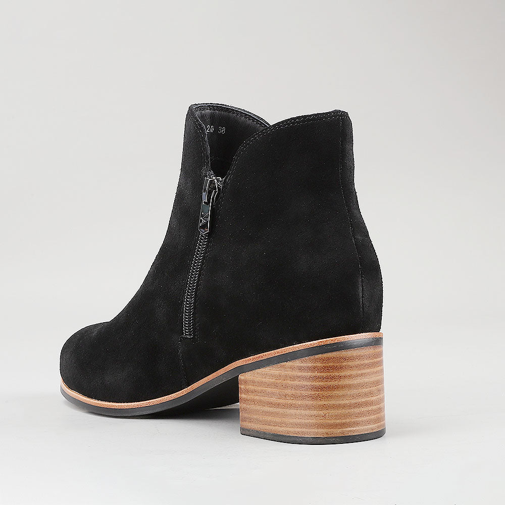 Naked Arches Oxley black suede boots with sleek design and rounded toes, displayed on a neutral background.