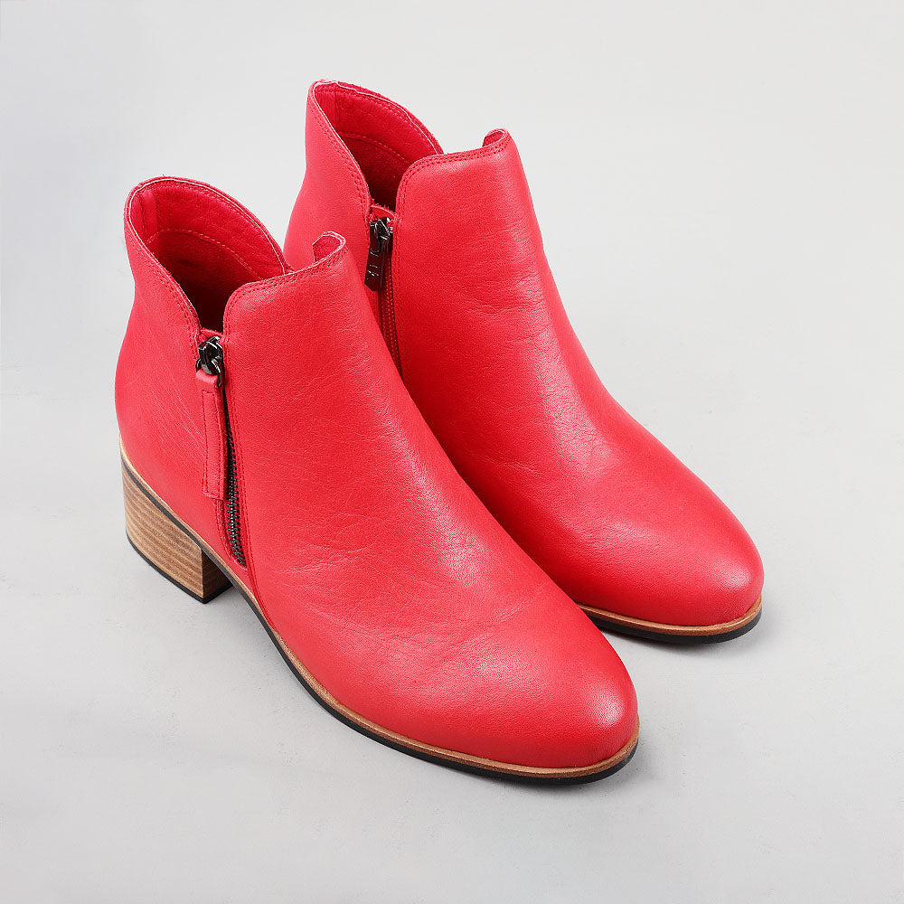 Pair of Naked Arches Oxley Red boots showing the stylish red leather upper and classic ankle boot silhouette.