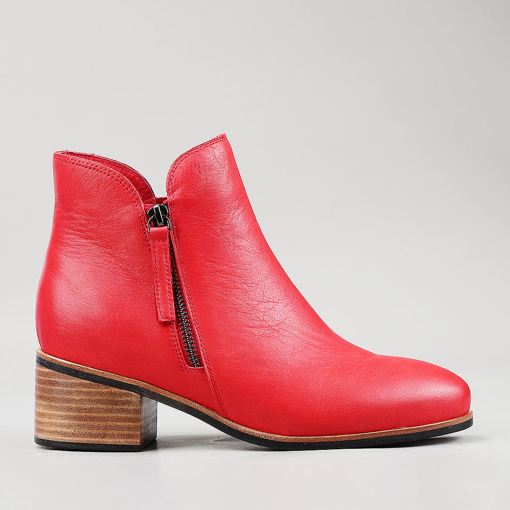 Naked Arches Oxley Red boots featuring a sleek red leather exterior and stylish ankle design.