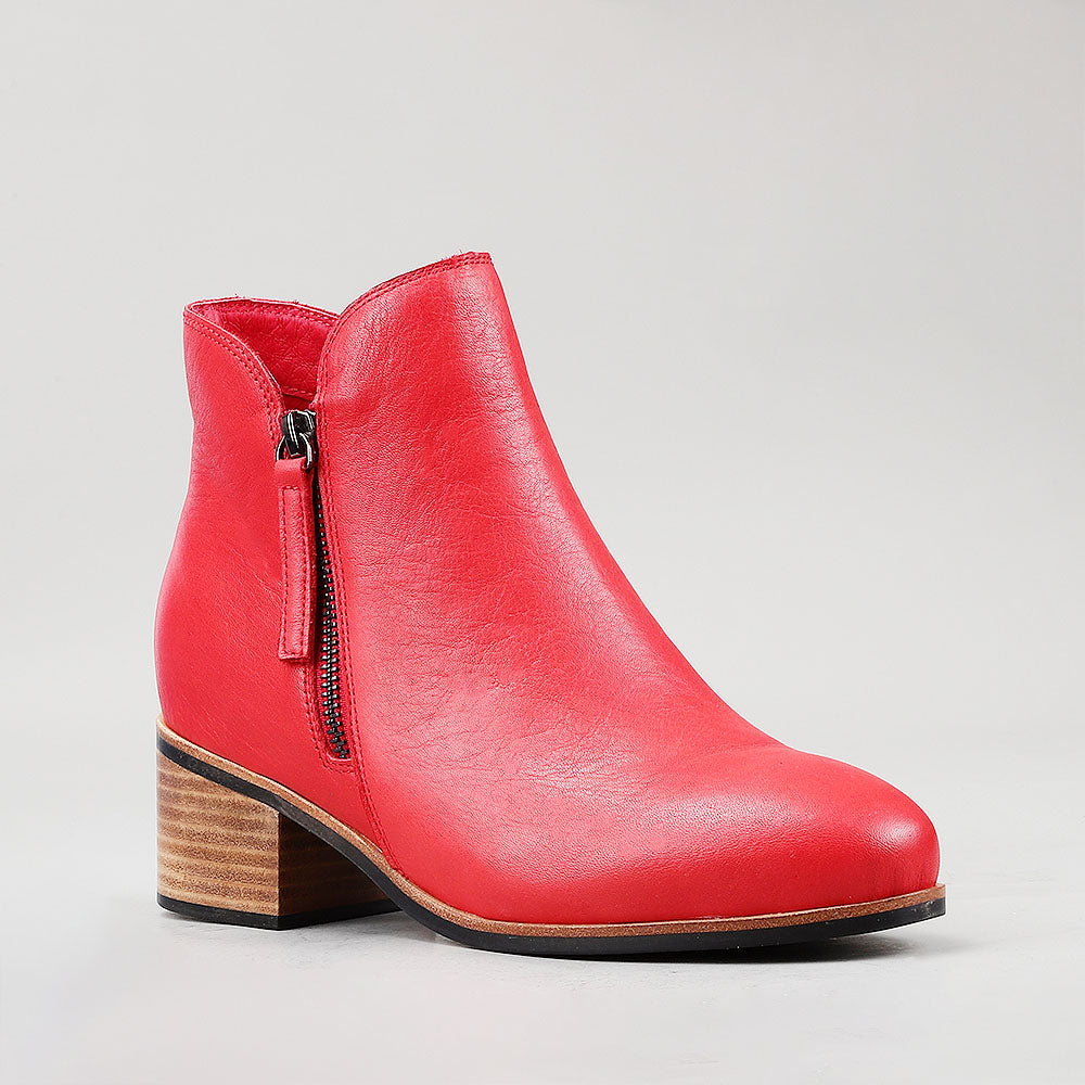 Naked Arches Oxley Red boots with a sleek design, featuring a rich red color and ankle-high style, perfect for stylish footwear.