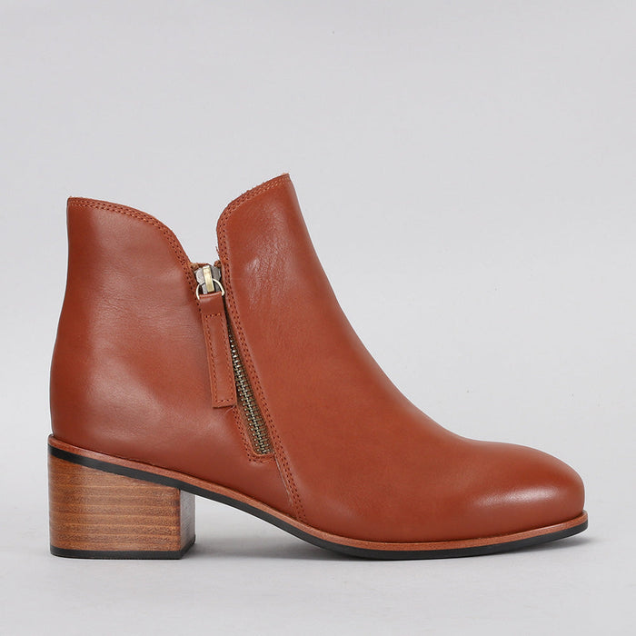 Naked Arches Oxley Cognac boots with sleek leather design and stylish side detailing, perfect for casual or dressy outfits.