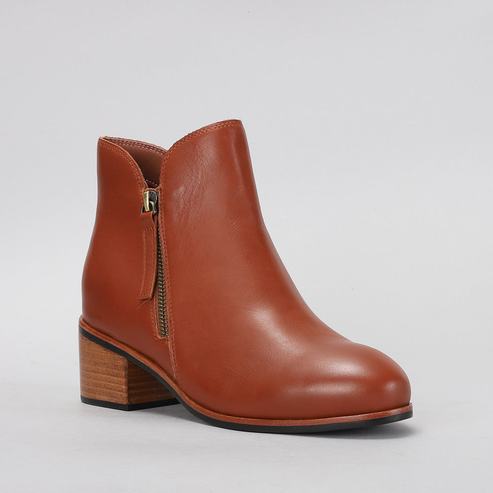 Naked Arches Oxley Cognac boots with rounded toe and ankle-high design, showcasing rich cognac leather and stylish stitching details.
