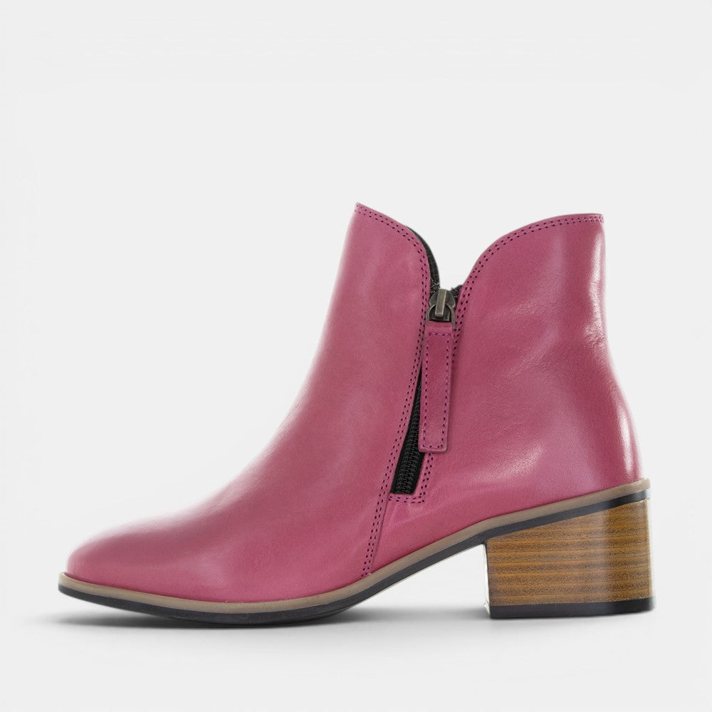 LE SANSA Oxley hot pink boots with sleek design and ankle height, featuring a stylish and vibrant appearance.