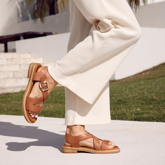Eos Brandy sandals with decorative ornaments, featuring a strappy design and open toe for stylish summer wear.