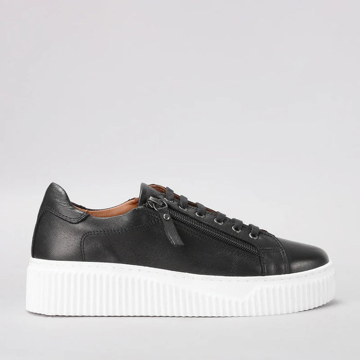 Le Sansa Palmer black sneakers shown from the side, featuring sleek design and black color, perfect for casual wear.