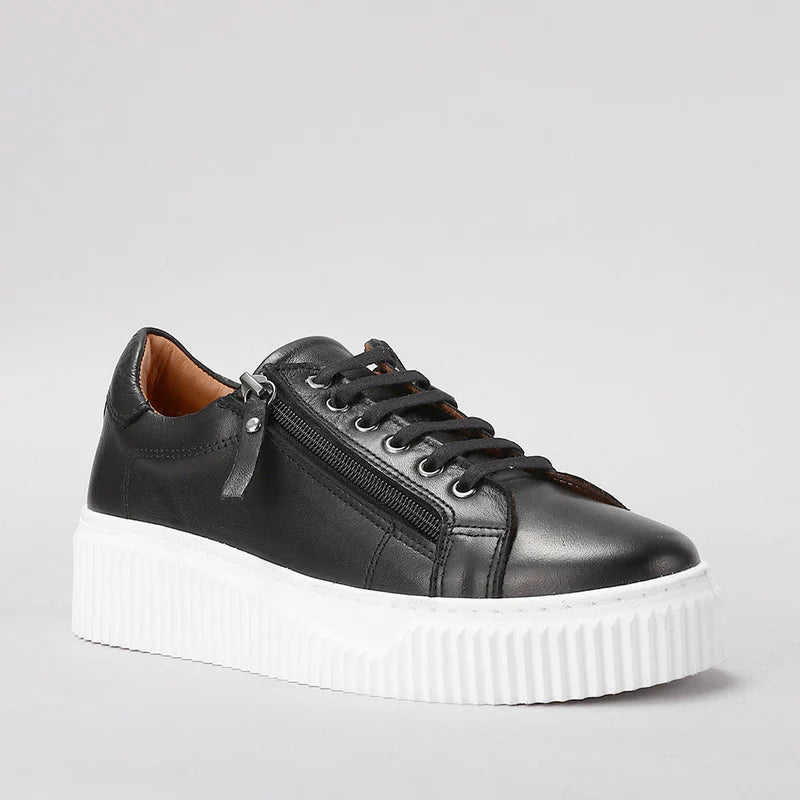 Le Sansa Palmer black sneakers with sleek design and white sole, showcasing a stylish and comfortable footwear option.