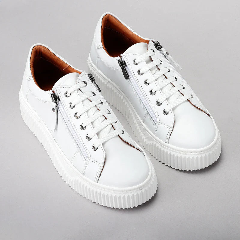 Pair of Le Sansa Palmer White sneakers featuring clean white design and casual style, perfect for everyday wear.