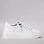 White Le Sansa Palmer sneakers featuring clean design and white laces, perfect for casual and sporty outfits.