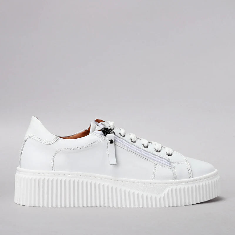 Le Sansa Palmer white sneakers with side detailing, casual footwear for everyday wear, featuring a sleek white design.