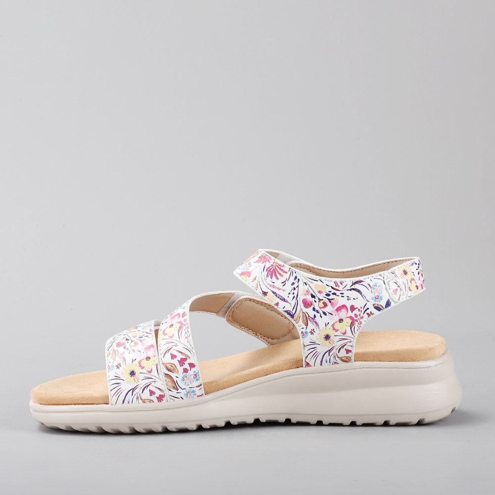 CC Resorts Pershing white floral sandals with open toes and ankle straps, featuring a stylish white floral design.