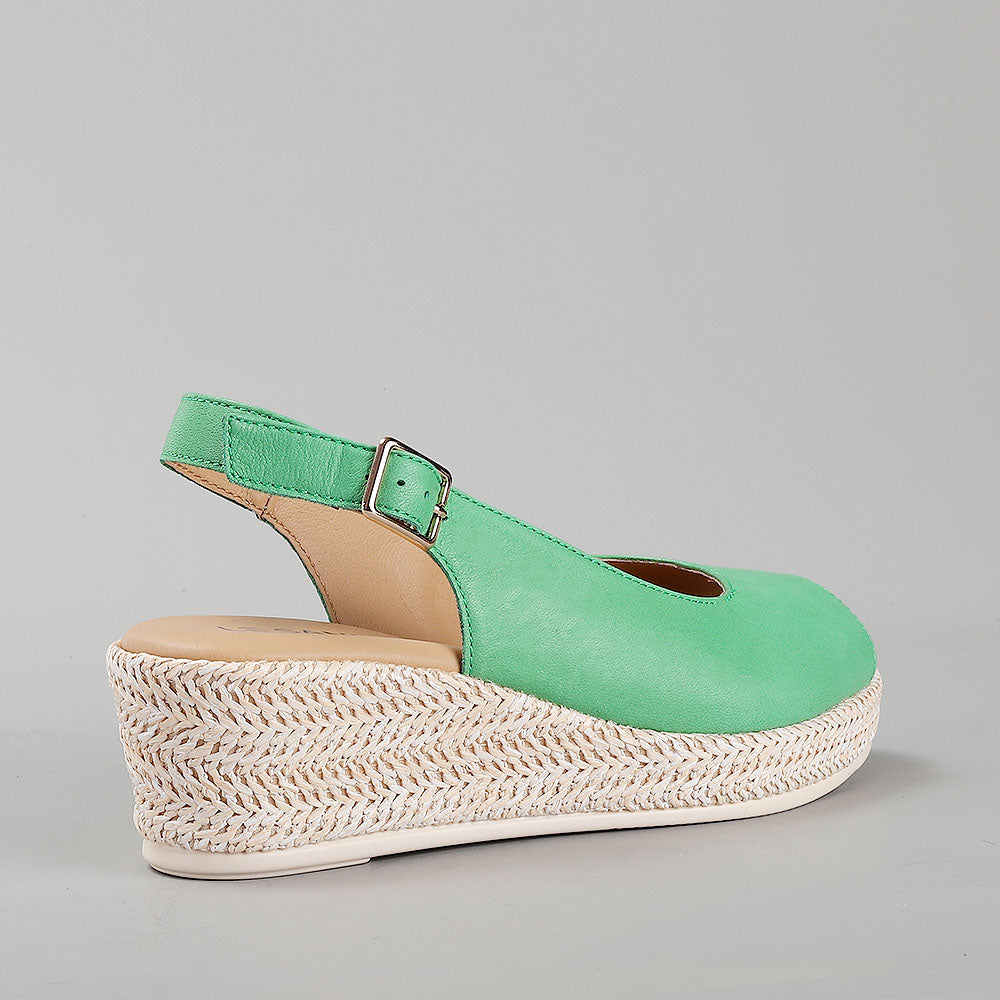 Le Sansa Petunia Fern Green sandals with green straps and comfortable flat sole, stylish and perfect for casual wear.