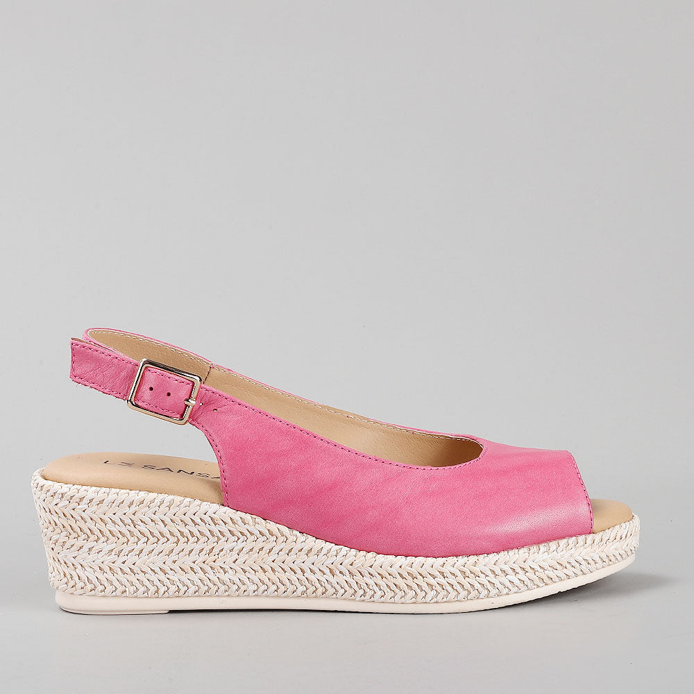 Le Sansa Petunia Hair sandals featuring beige straps and a flat sole, perfect for casual summer wear.