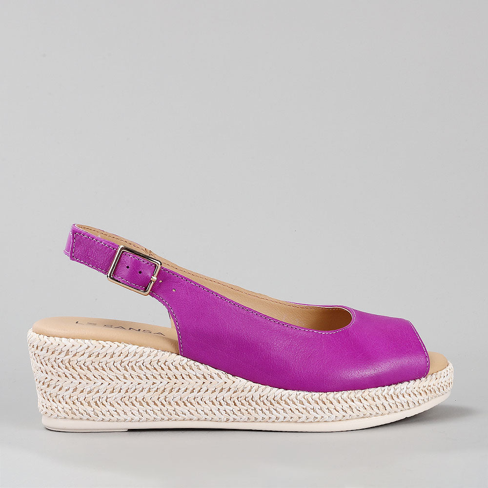 Le Sansa Petunia Purple sandals with purple straps and open-toe design, perfect for casual summer wear.