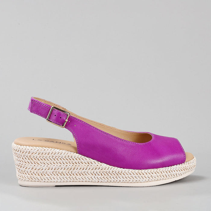 Le Sansa Petunia Purple sandals with purple straps and open-toe design, perfect for casual summer wear.