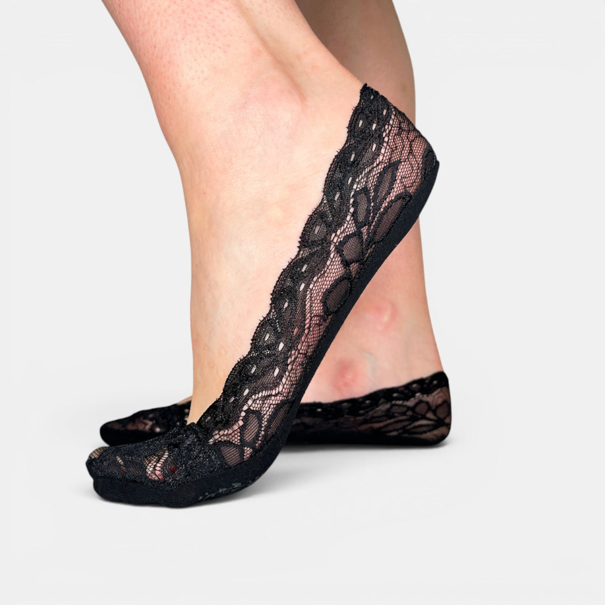 Close-up of Minx lace sockette socks featuring delicate lace detail and soft fabric in a stylish, feminine design.