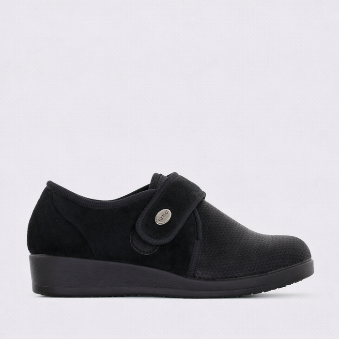 Black Fly Flot slip-on shoes, model Q3886, with sleek design and comfortable fit, shown from the side.