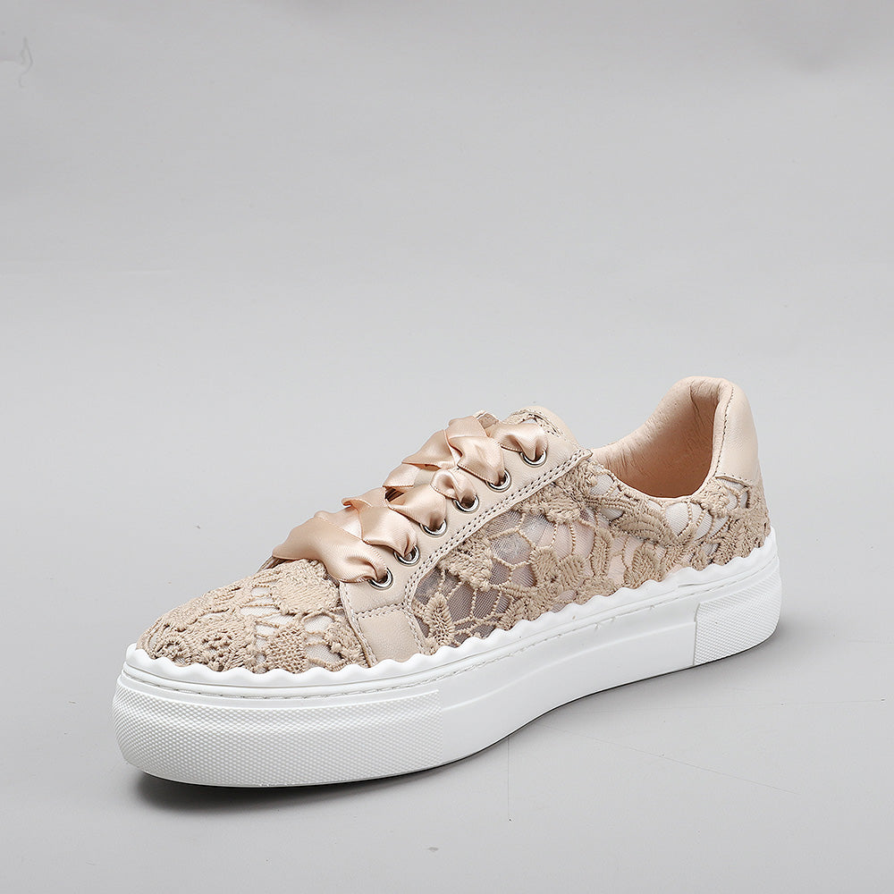 Le Sansa Quinn taupe sneakers featuring a sleek design, casual style, and comfortable fit, shown in a close-up image.