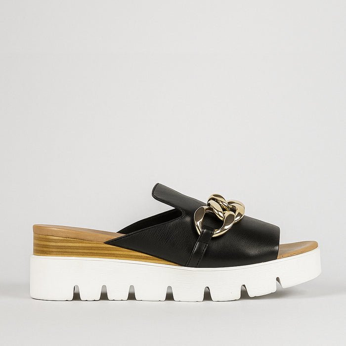 Black Django & Juliette Rablise slip-ons featuring a sleek design and comfortable fit, perfect for casual or stylish everyday wear.