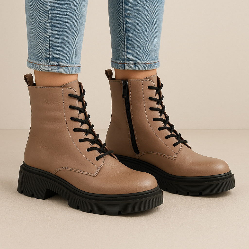Black LE SANSA Radiant Hat boots with sleek design and stylish laces, showcased on a neutral background.