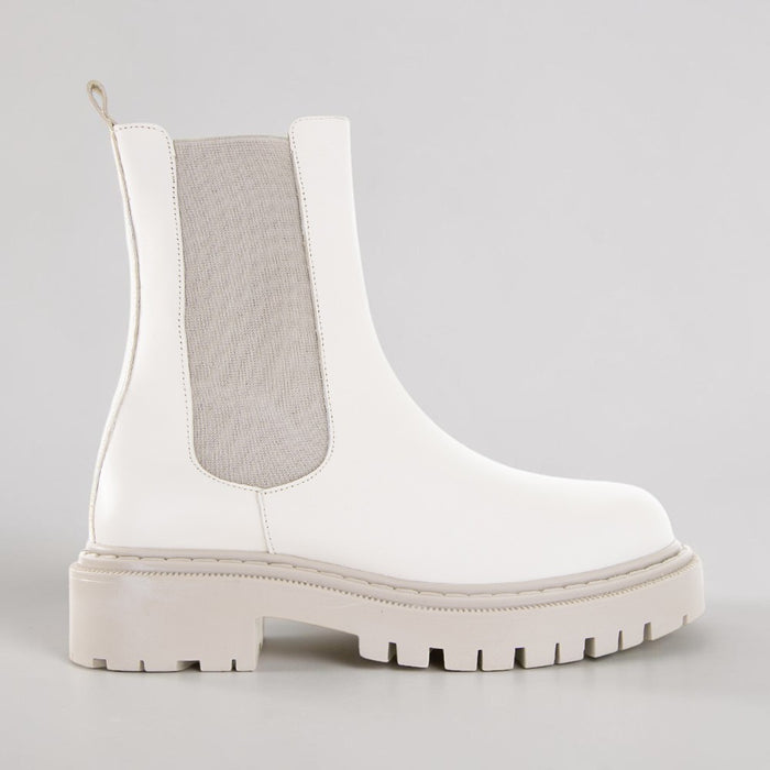 Le Sansa Rebecca vanilla boots with stylish design and ankle-height cut, showcased in a natural pose.