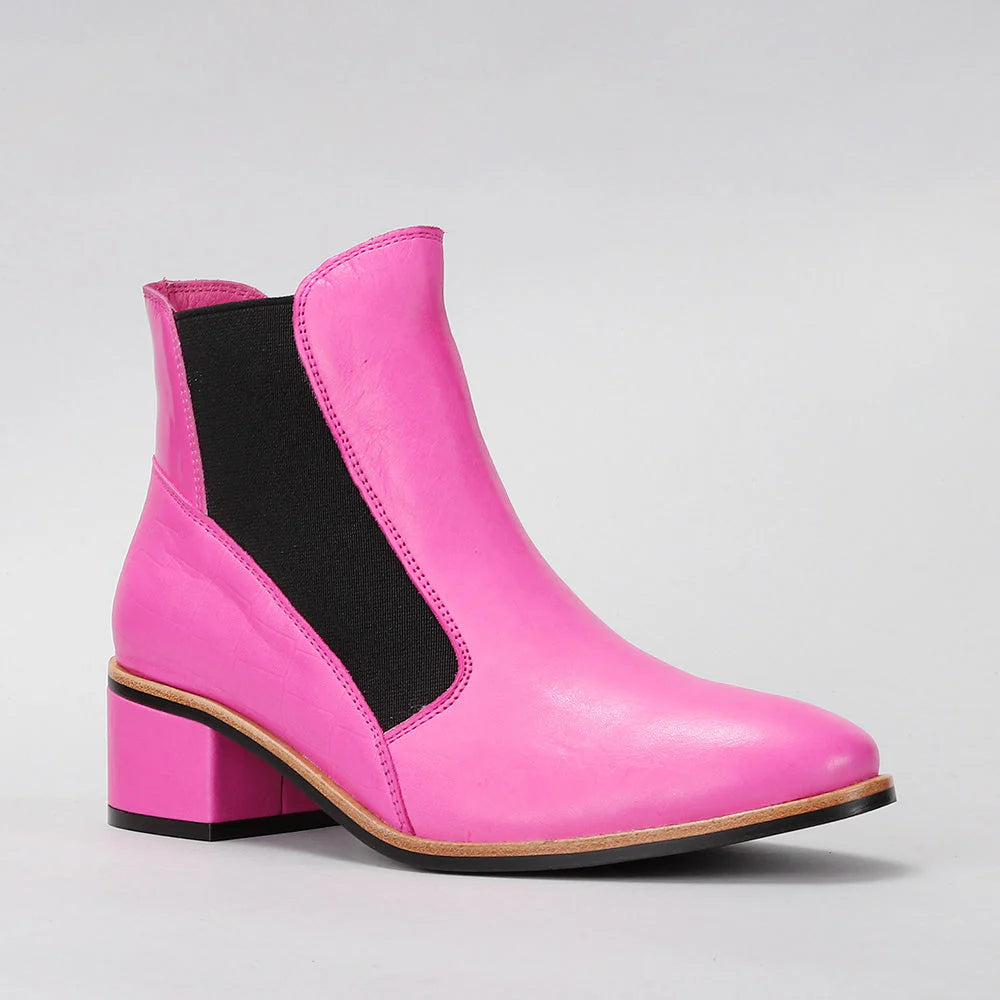 LE SANSA Refresh Pink boots with black gussets, showcasing a stylish, vibrant footwear design in hot pink and black.
