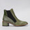 LE SANSA Refresh Olive boots shown from side view, featuring ankle-height design with olive green leather and stylish laces.