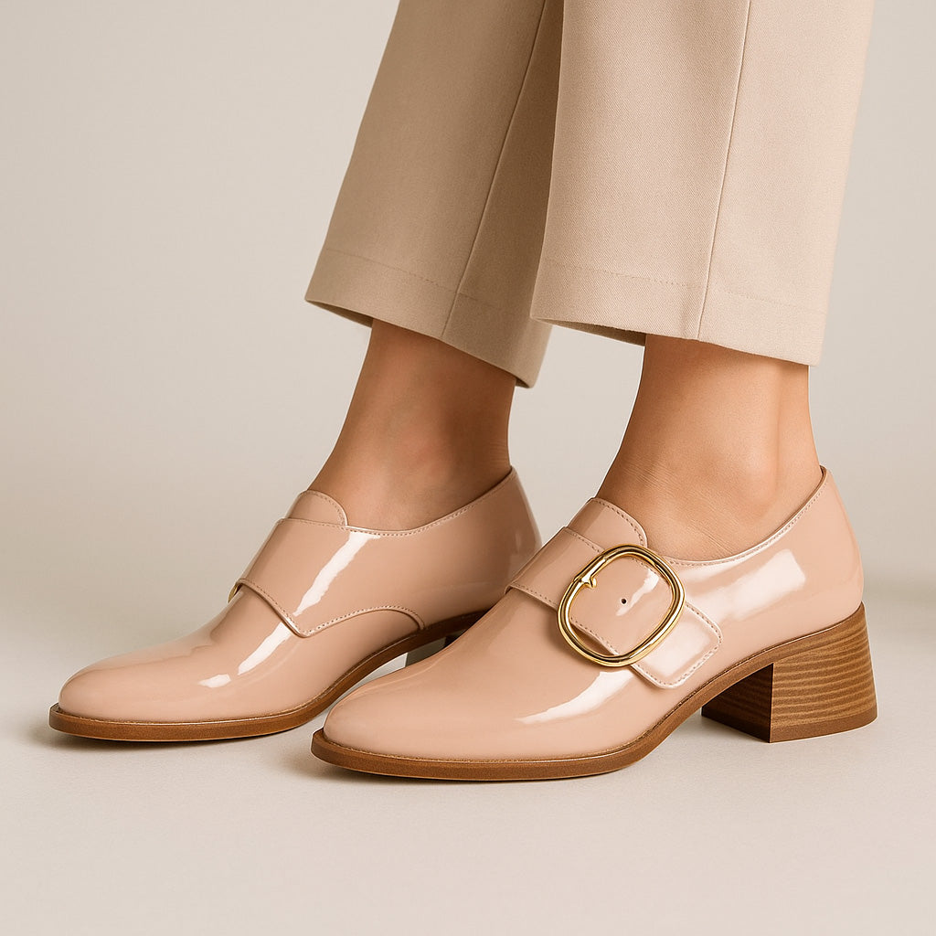 Le Sansa Rice Blush patent loafers with sleek design and shiny finish, showcasing the elegant footwear style.