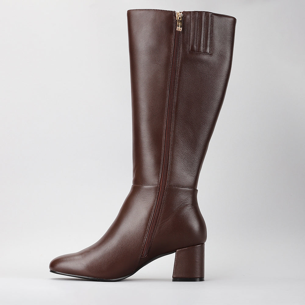 Le Sansa Robel chocolate high boots with sleek design and ankle height, made for stylish winter wear.