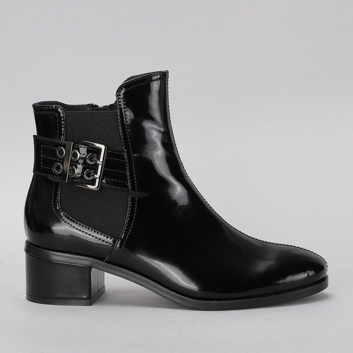 Le Sansa Romy black leather boots viewed from the side, showcasing sleek design and ankle height.