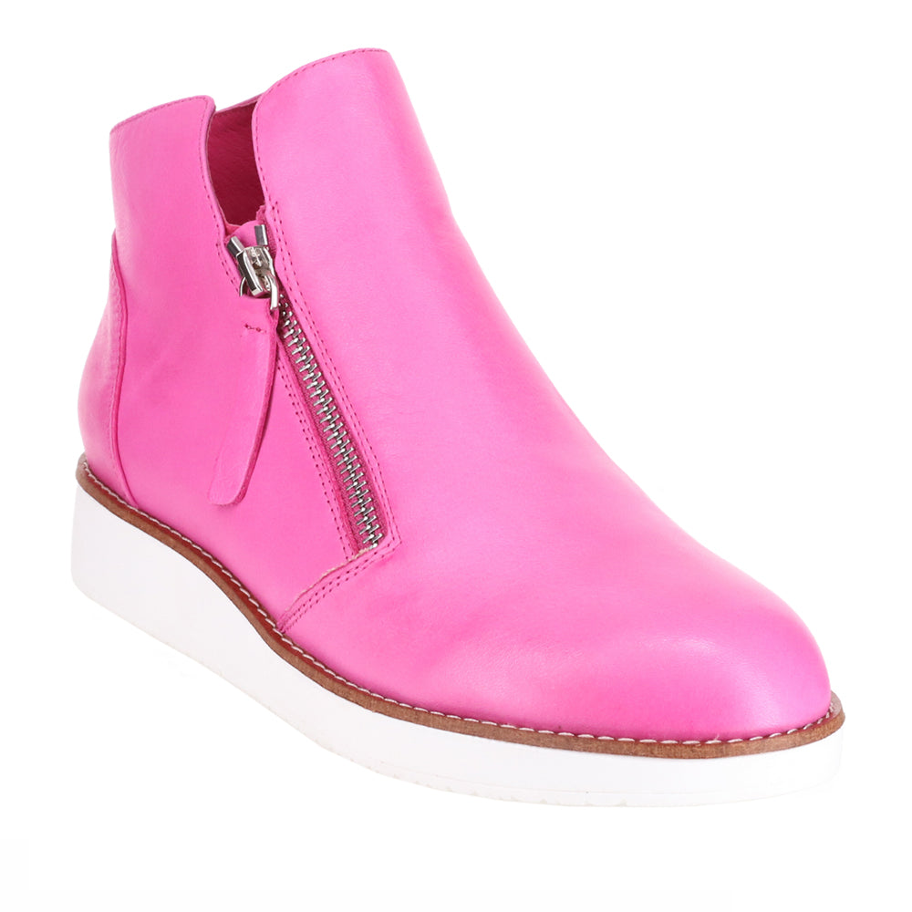 Le Sansa Ronnie Hot Pink boots featuring a sleek design with a vibrant pink color and stylish ankle-high silhouette.