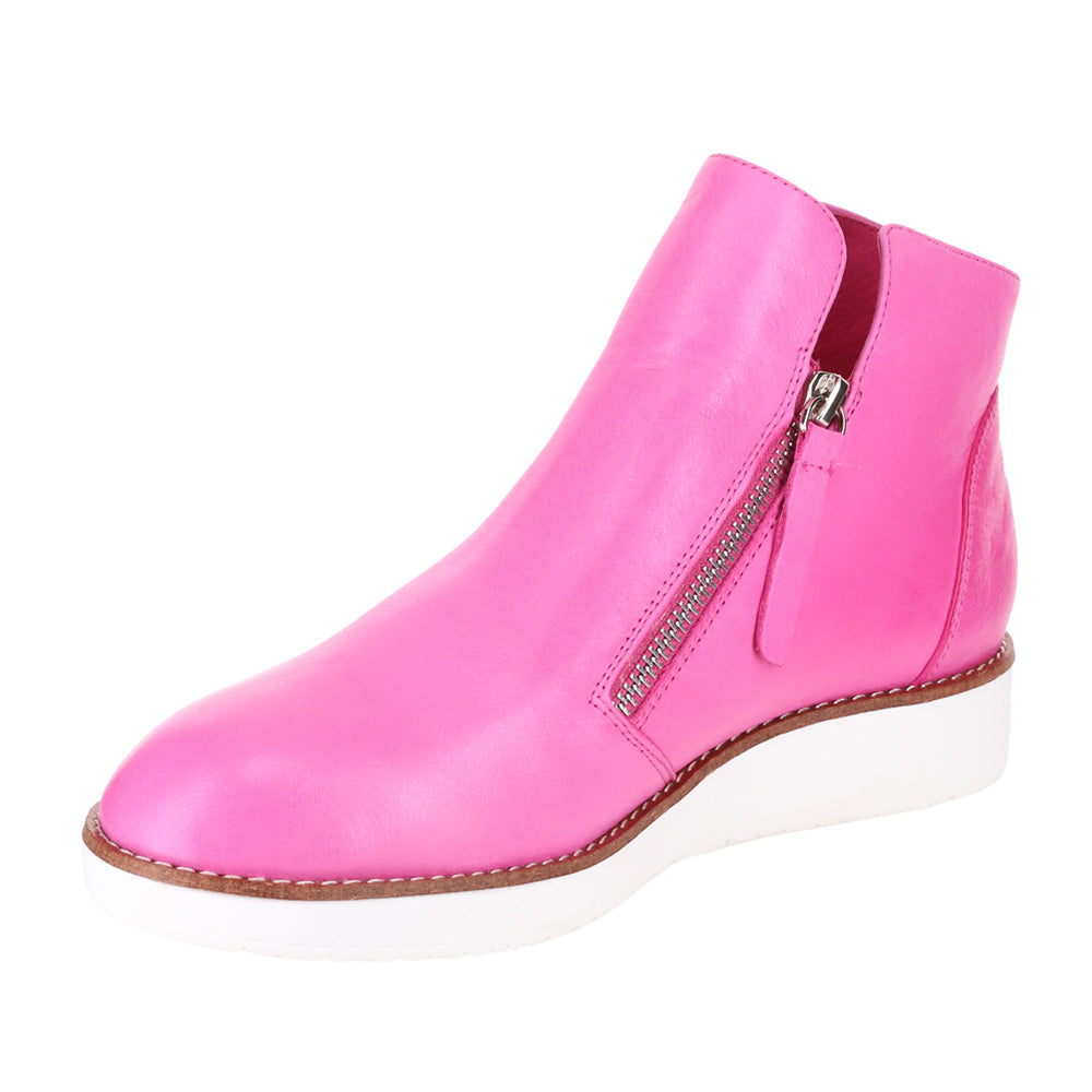 Le Sansa Ronnie hot pink boots with chunky soles and stylish design, perfect for bold fashion statements.