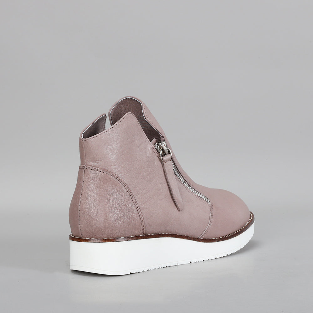 Le Sansa Ronnie taupe boots with ankle-length design and stylish stitching, shown from the northeast angle.