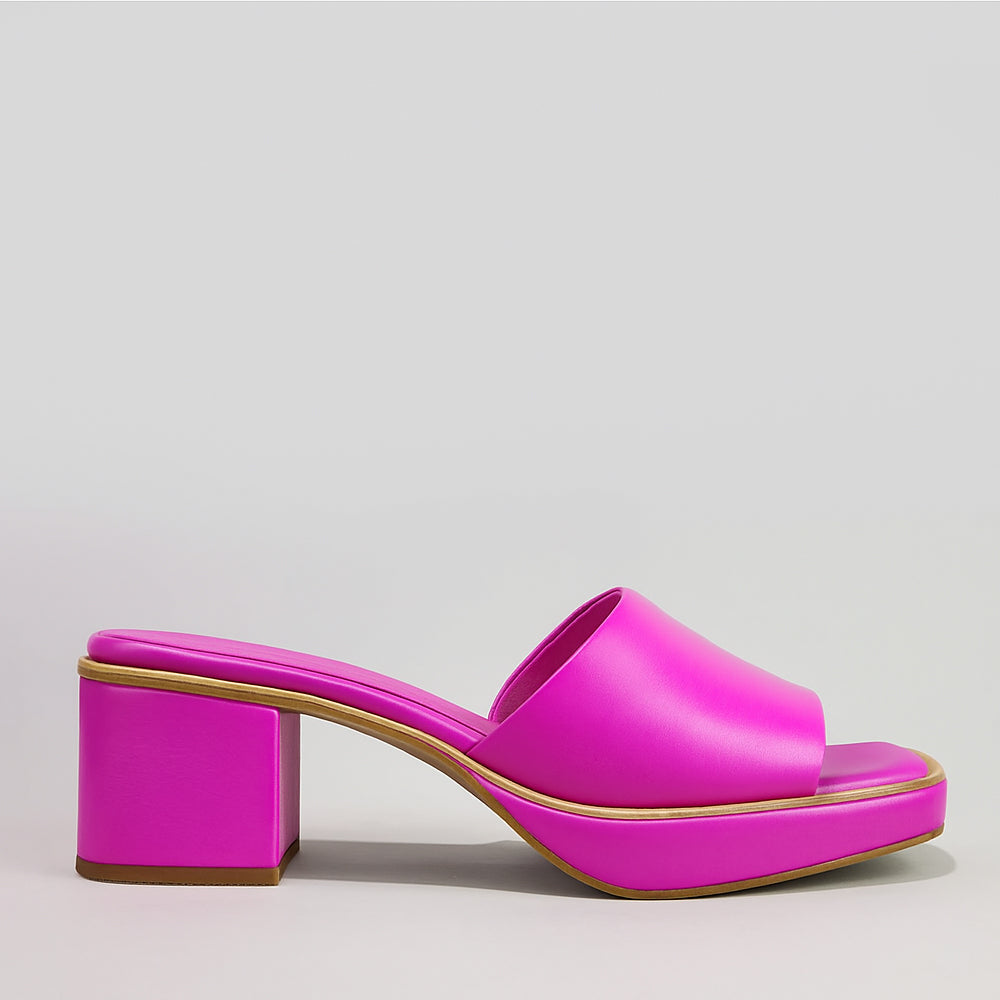 Le Sansa Rosemary hot pink slip-on shoes with a sleek design and comfortable fit, shown on a white background.