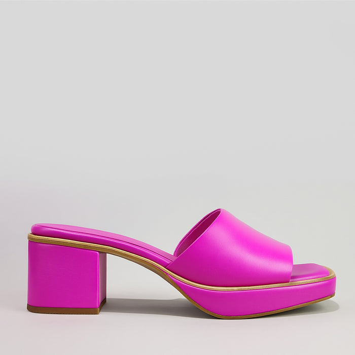 Le Sansa Rosemary hot pink slip-on shoes with a sleek design and comfortable fit, shown on a white background.