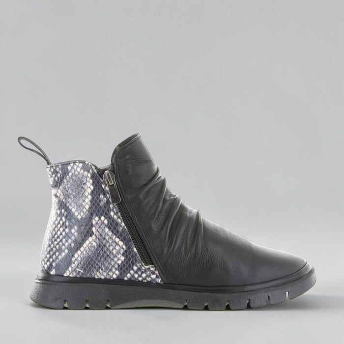 Le Sansa Rubel Black Print boots featuring stylish black printed leather with a sleek, modern design and sturdy sole.